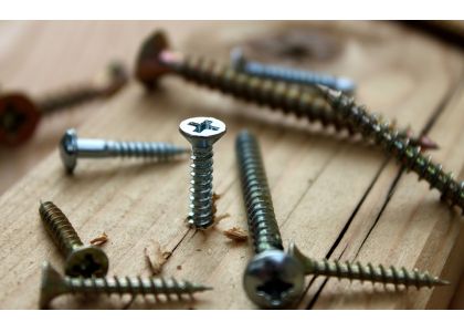 What materials are screws generally made of? What are the advantages and disadvantages of these materials